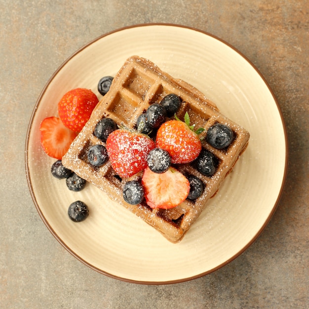 Free Photo waffles with raspberry and blueberry