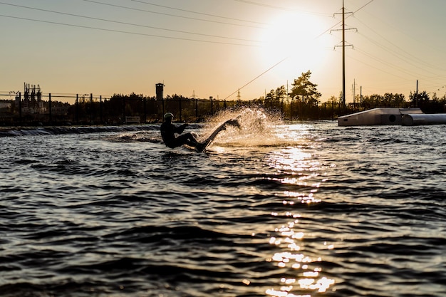 Free photo wakeboard. wakeboarding jumping at sunset