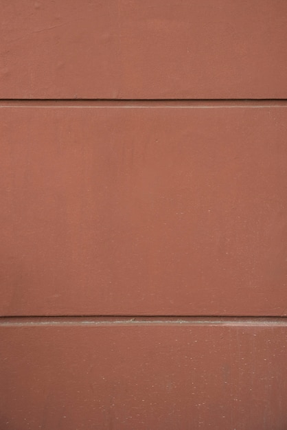 Wall of brown rock blocks