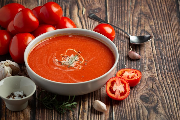 Warm tomato soup serve in bowl