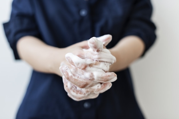 Free Photo washing hands with soap to prevent coronavirus contamination