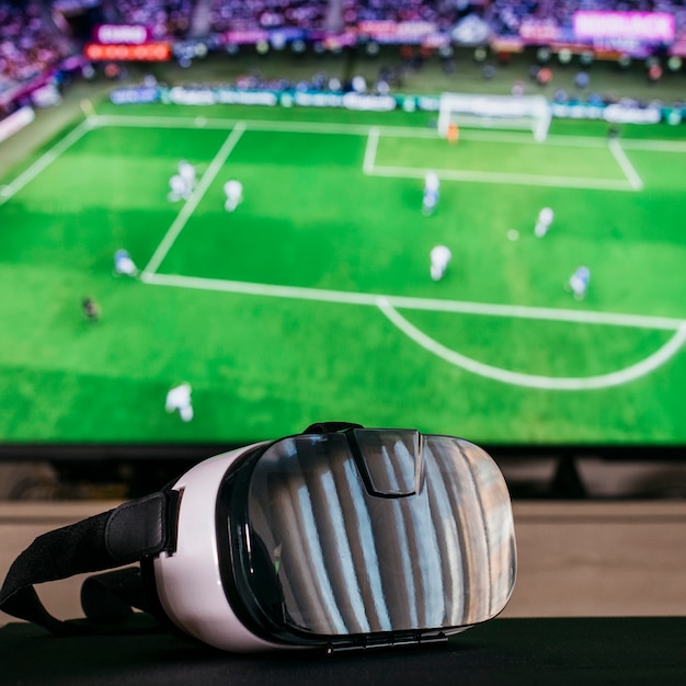 Free photo watching football concept with vr glasses