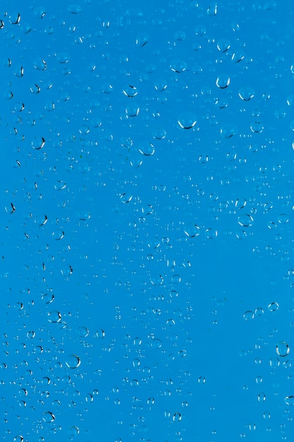 Water drops on blue surface