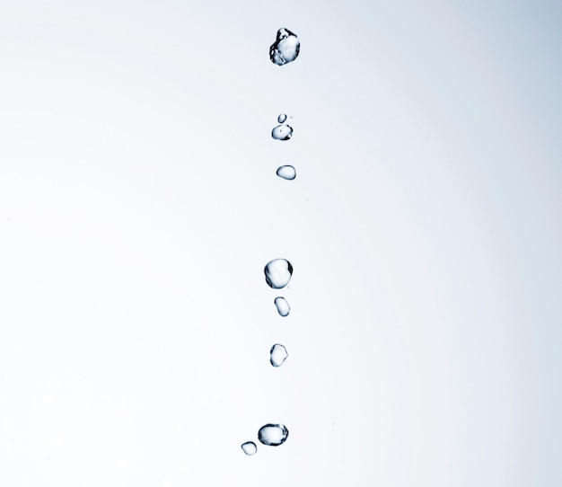 Water drops on white background close-up