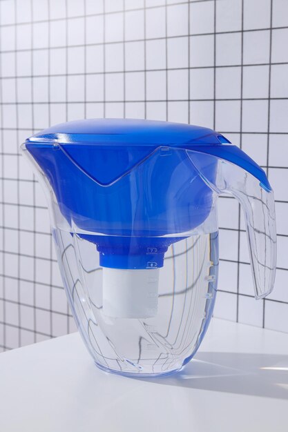 Water filter with a blue cap on a white background