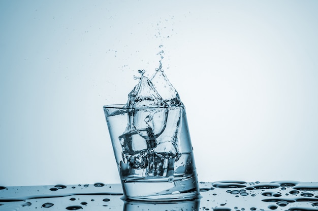 Water in glass with water splash