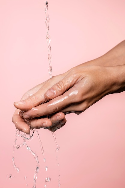 Free photo water poured on woman's hands