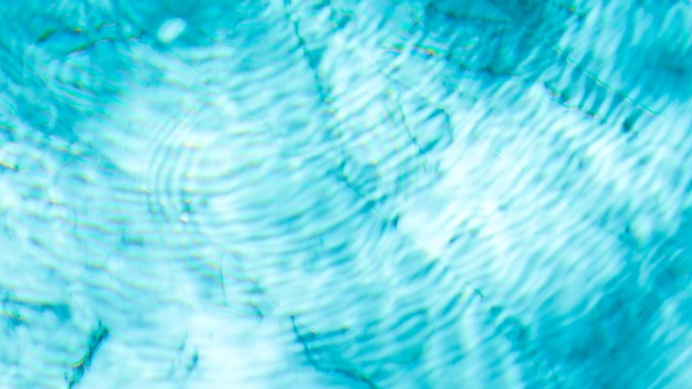 Water swimming pool texture and surface water on pool reflection blue wave nature water on the outdo...