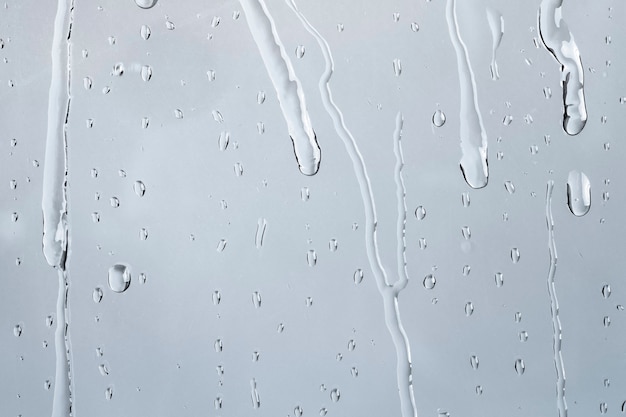 Free photo water texture background, rainy window on cloudy day