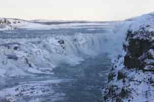 Free photo waterfall of gullfoss in iceland, europe surrounded by ice and snow