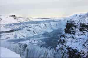 Free photo waterfall of gullfoss in iceland, europe surrounded by ice and snow