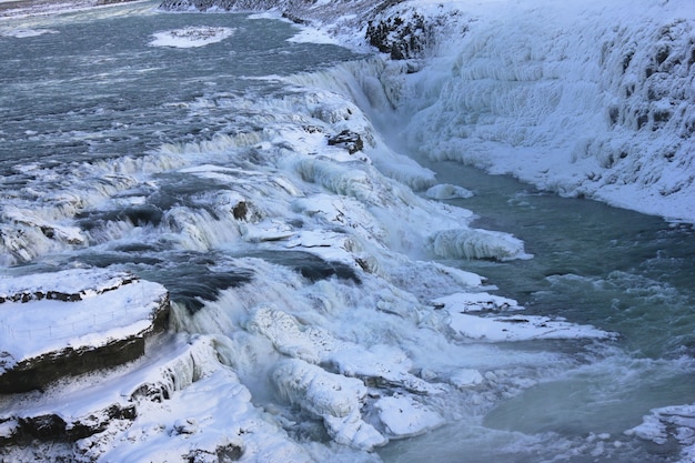 Free photo waterfall of gullfoss in iceland, europe surrounded by ice and snow