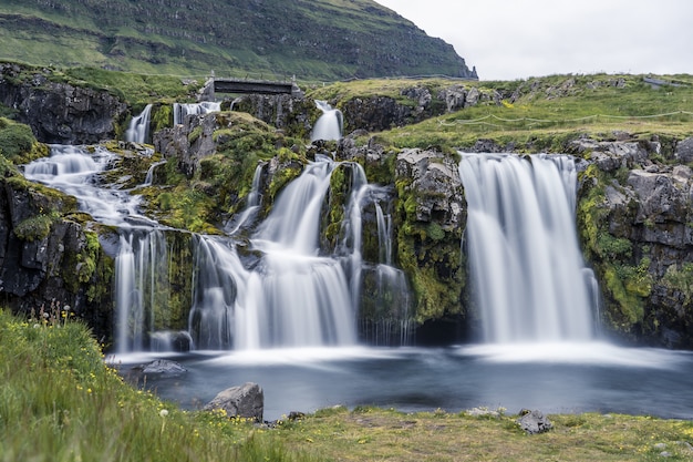 Free Photo waterfall on the kirkjufell mountain at daytime in iceland