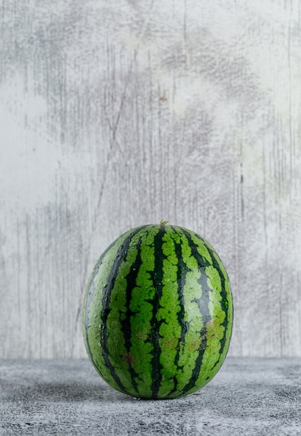 Watermelon on grey grunge table