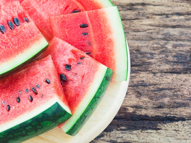 Watermelon on old wooden background