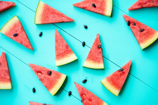 Watermelon slices on blue table