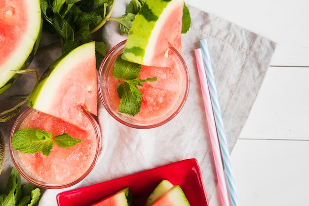 Free Photo watermelon smoothies and straws on napkin