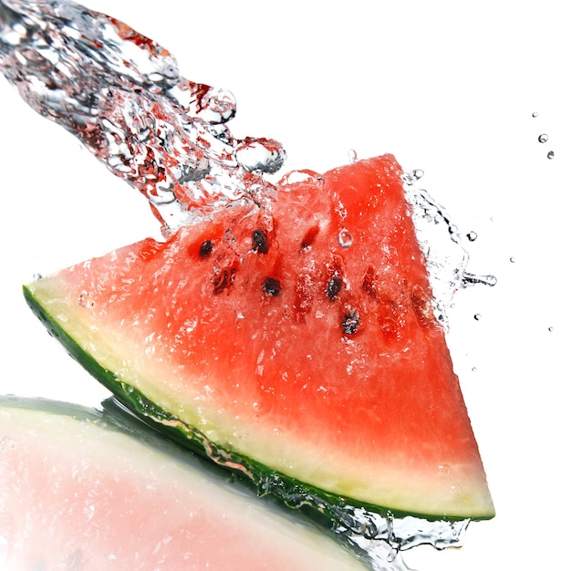 Free photo watermelon and water splash isolated on white