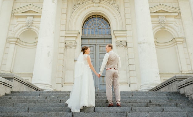  Wedding couple. Beautiful couple, bride and groom look at each other 