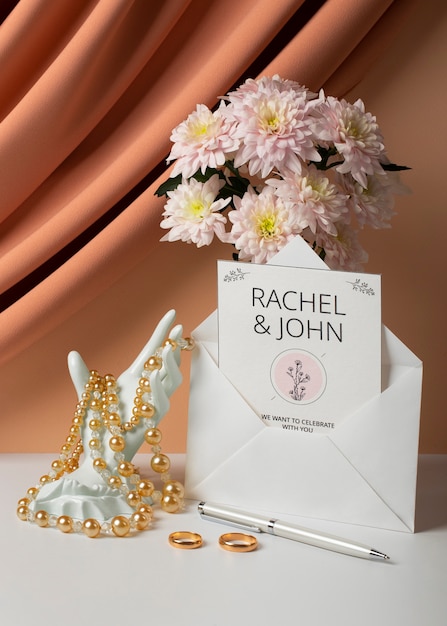 Free photo wedding invitation and flowers arrangement