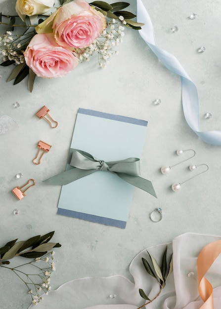 Free Photo wedding invitations and floral ornaments on table