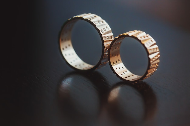 Free photo wedding rings captured with a reflection in a surface