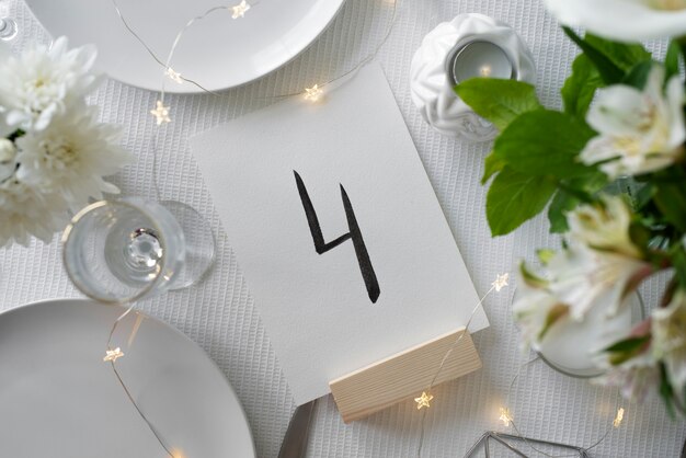 Wedding table number and flowers top view