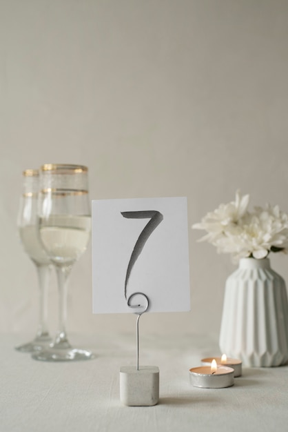 Free photo wedding table number and glasses arrangement