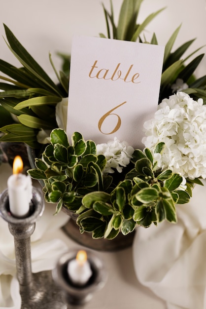 Wedding table number with beautiful flowers high angle