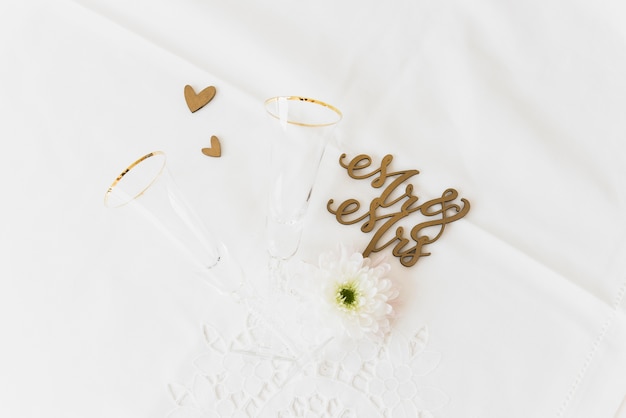 Free Photo wedding word mr and mrs with flower; drinking glass and heart shape on white background