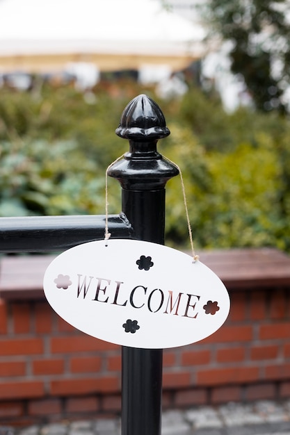 Free Photo welcome sign hanging outside