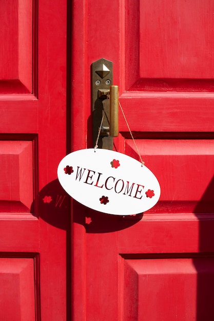 Free photo welcome sign on red door