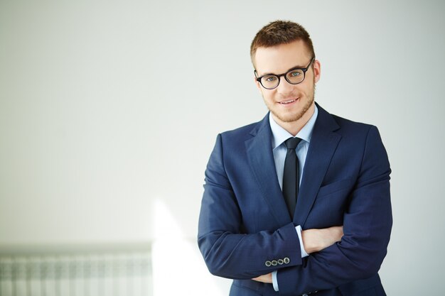 Well-dressed executive with crossed arms