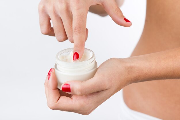 wellbeing people touching moisturizer white