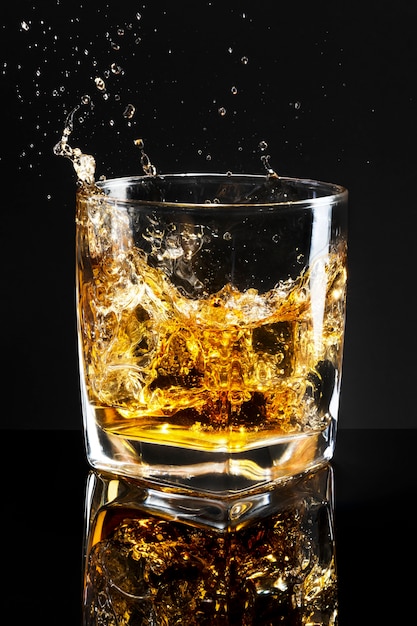 Whiskey on the rocks black background