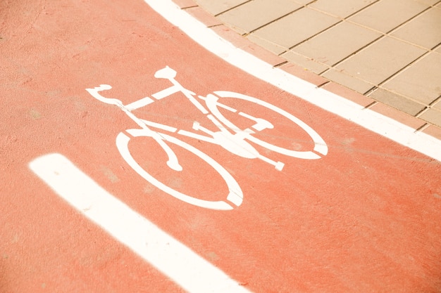 Free Photo white bike sign on cycle lane