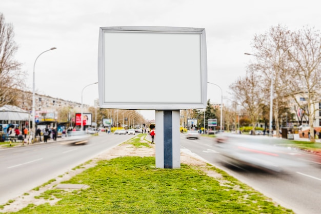 Free photo white billboard advertising mockup in busy street