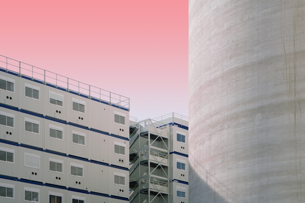 Free photo white and blue concrete structures on a pink sky