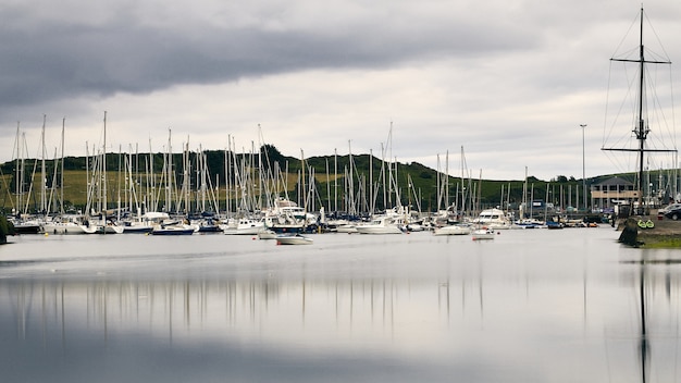 Free Photo white boats on the shoreline of kinsale