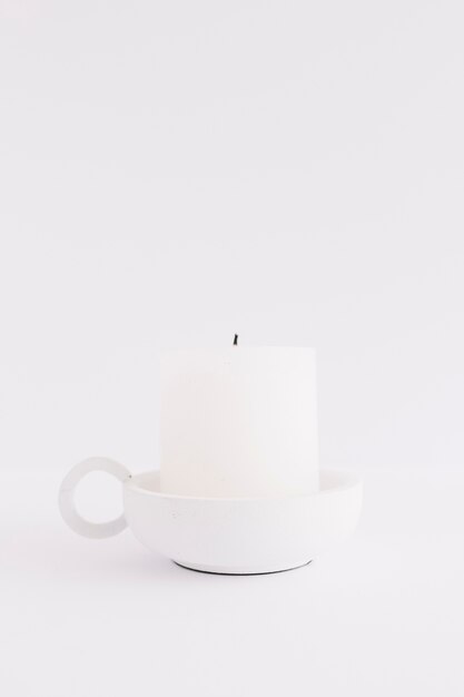 White candle in candlestick 