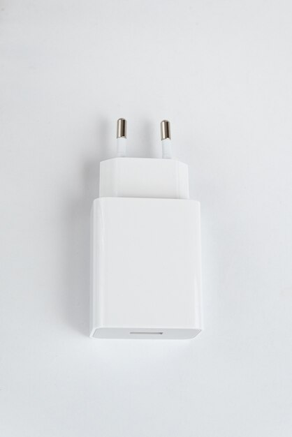 White cell phone charger on the white isolated background