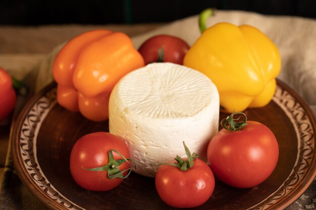 White cheese, red tomatoes and yellow peppers