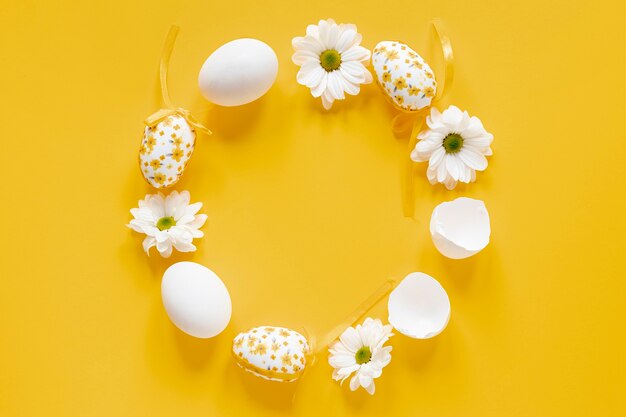 White circle of flowers and eggs