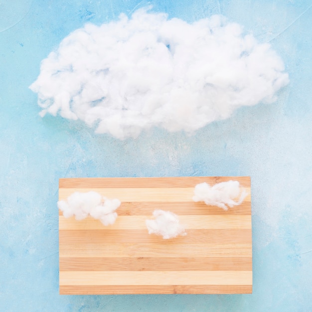 Free photo white cloud on wooden table