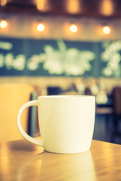 White coffee cup in coffee shop cafe