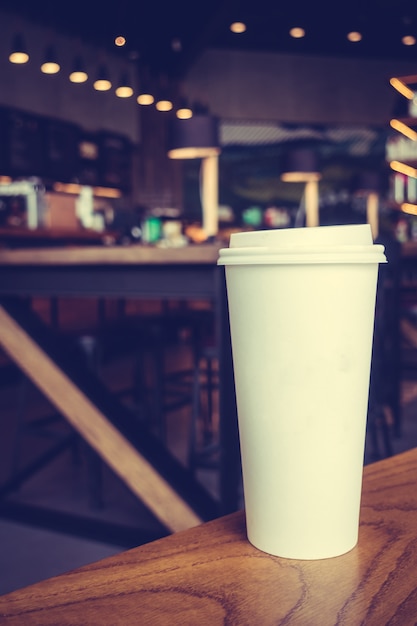 Free photo white coffee cup on table