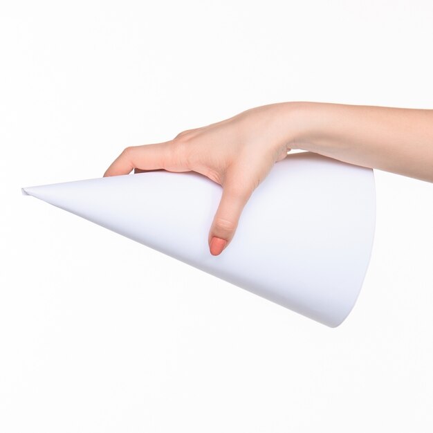 The white cone of the props in the female hands on white background with  right shadow