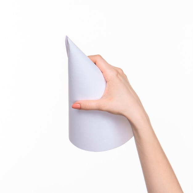 white cone of the props in the female hands on white background with right shadow