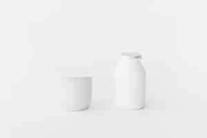 Free photo white containers of dairy