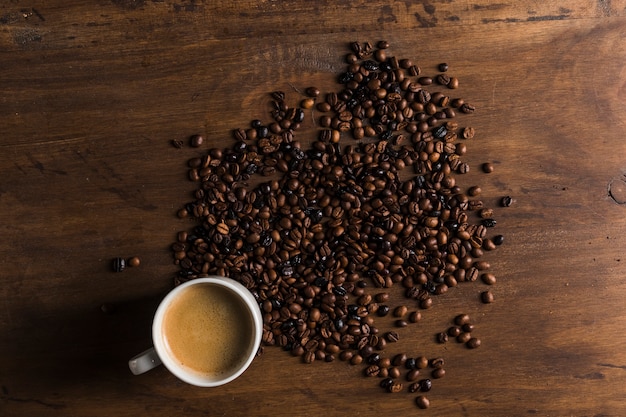 White cup and coffee beans